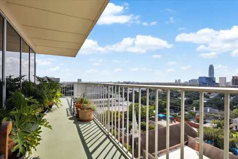 a view of a balcony with chairs