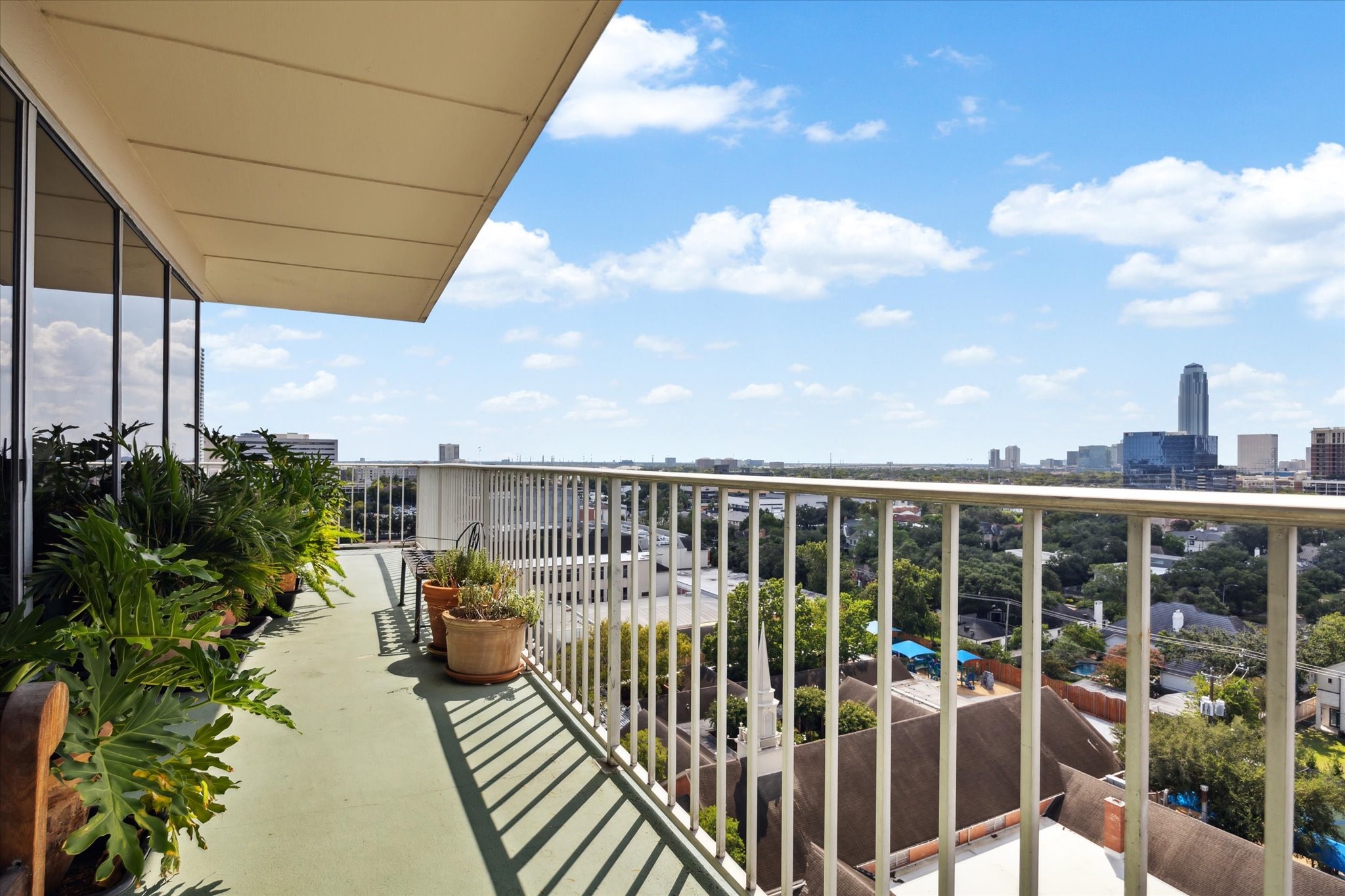 2200 Willowick Road, Unit 11C Houston, TX 77027 - Photo 14 of 14 a view of a balcony with chairs
