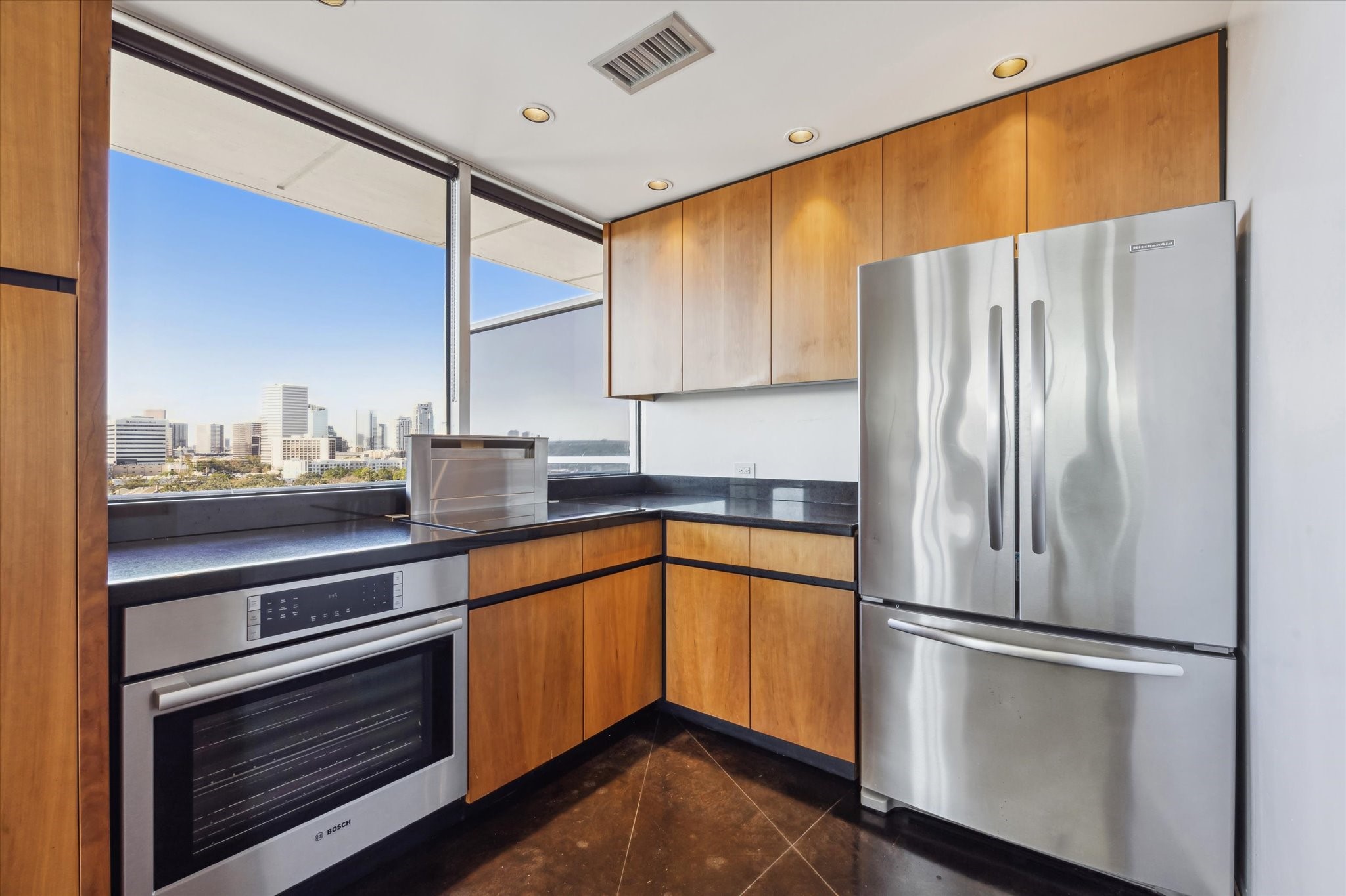 2200 Willowick Road, Unit 11C Houston, TX 77027 - Photo 4 of 14 a kitchen with stainless steel appliances a refrigerator and a sink