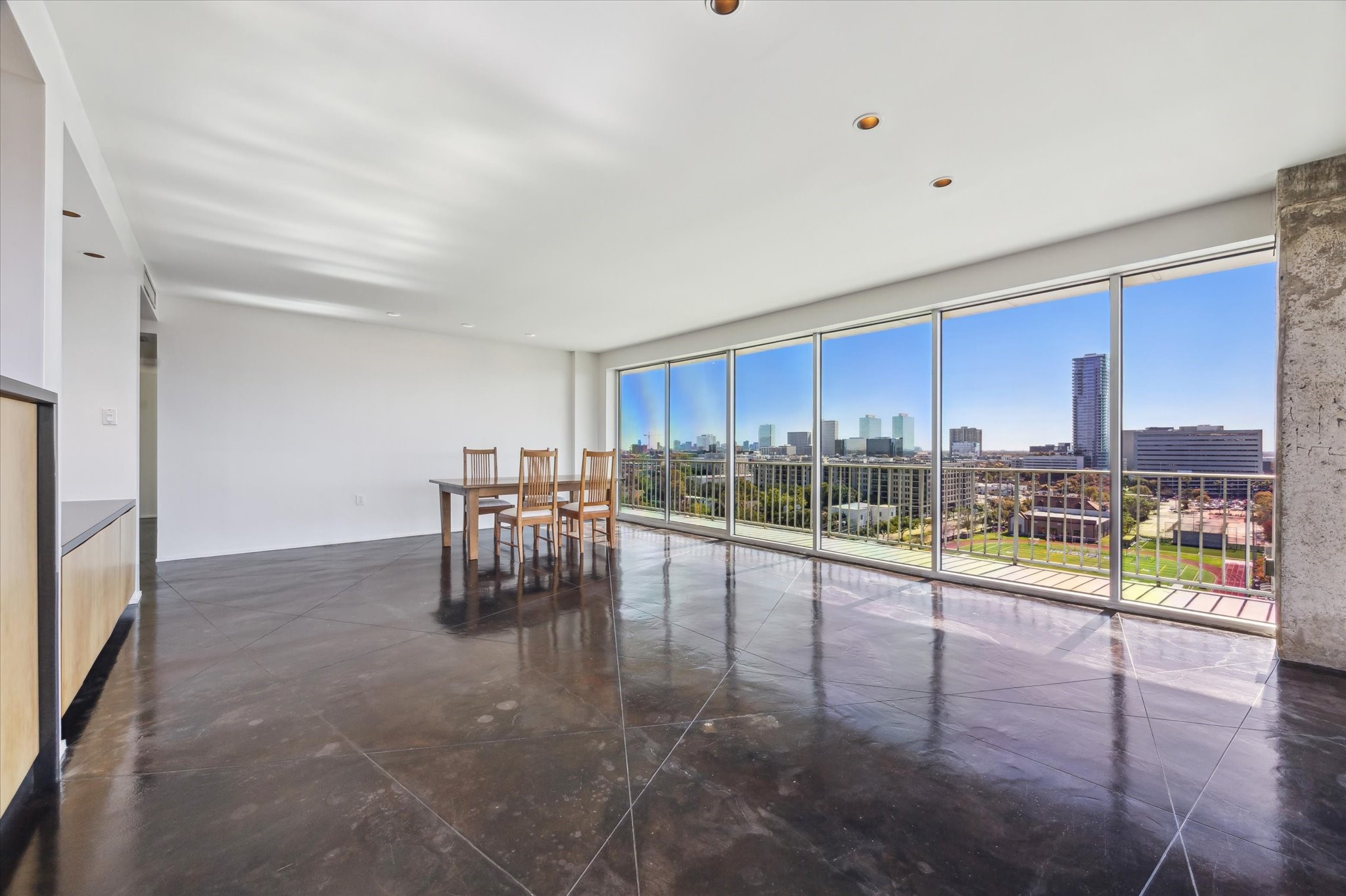 2200 Willowick Road, Unit 11C Houston, TX 77027 - Photo 6 of 14 a view of a living room and a floor to ceiling window