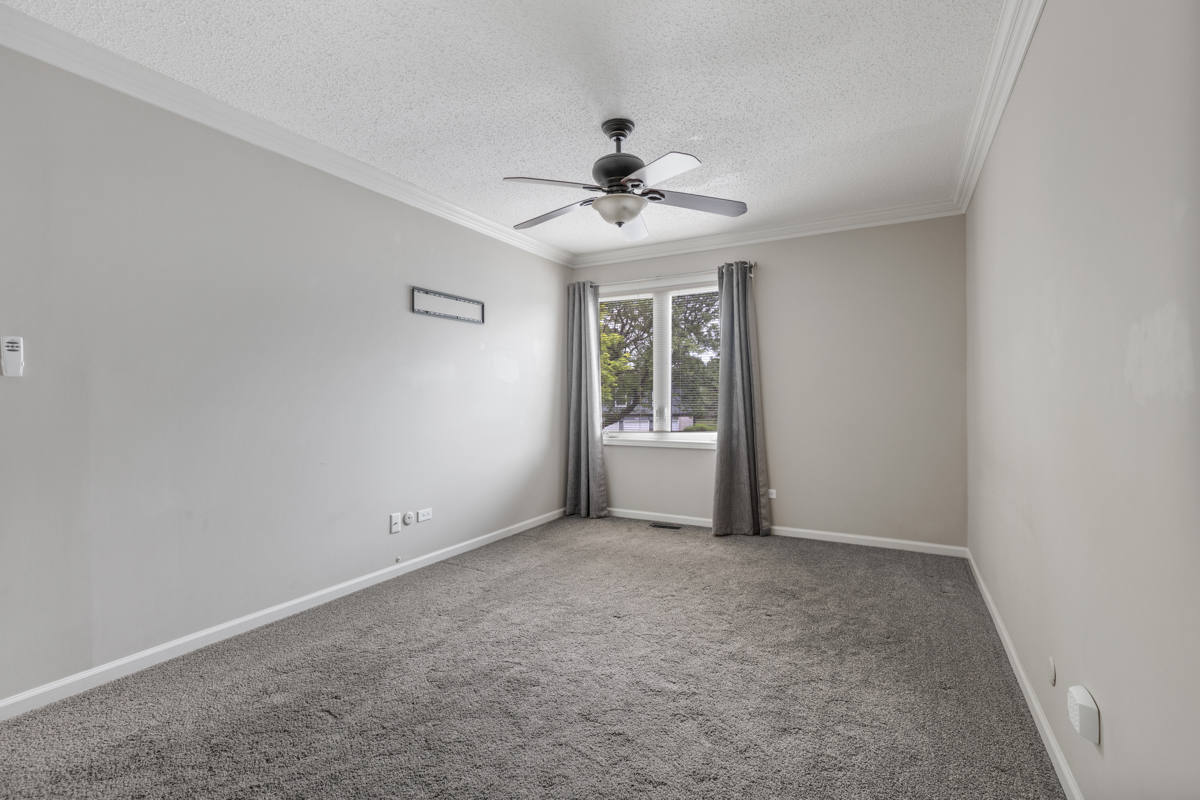 1004 Inverrary Lane Deerfield, IL 60015 - Photo 12 of 19 wooden floor in an empty room with a window