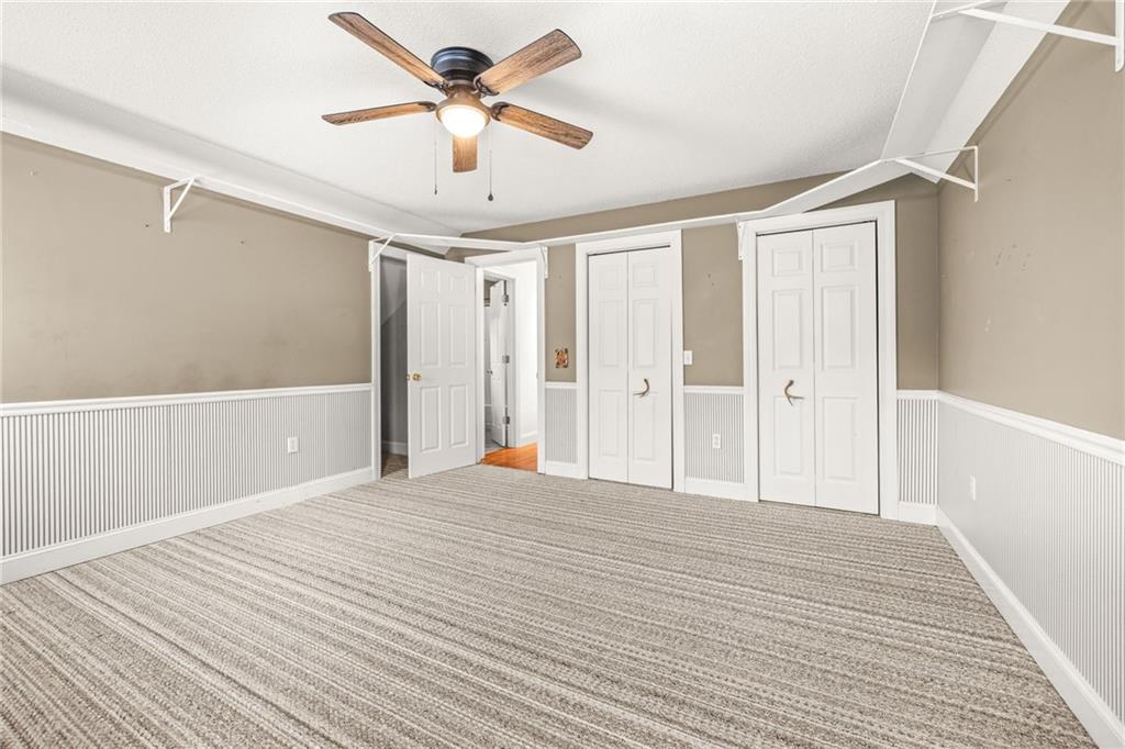 131 Caudell Drive Lula, GA 30554 - Photo 29 of 68 a view of a livingroom with a ceiling fan & a rug