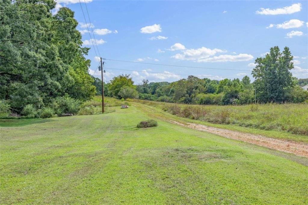 131 Caudell Drive Lula, GA 30554 - Photo 52 of 68 a view of yard with swimming pool and green space