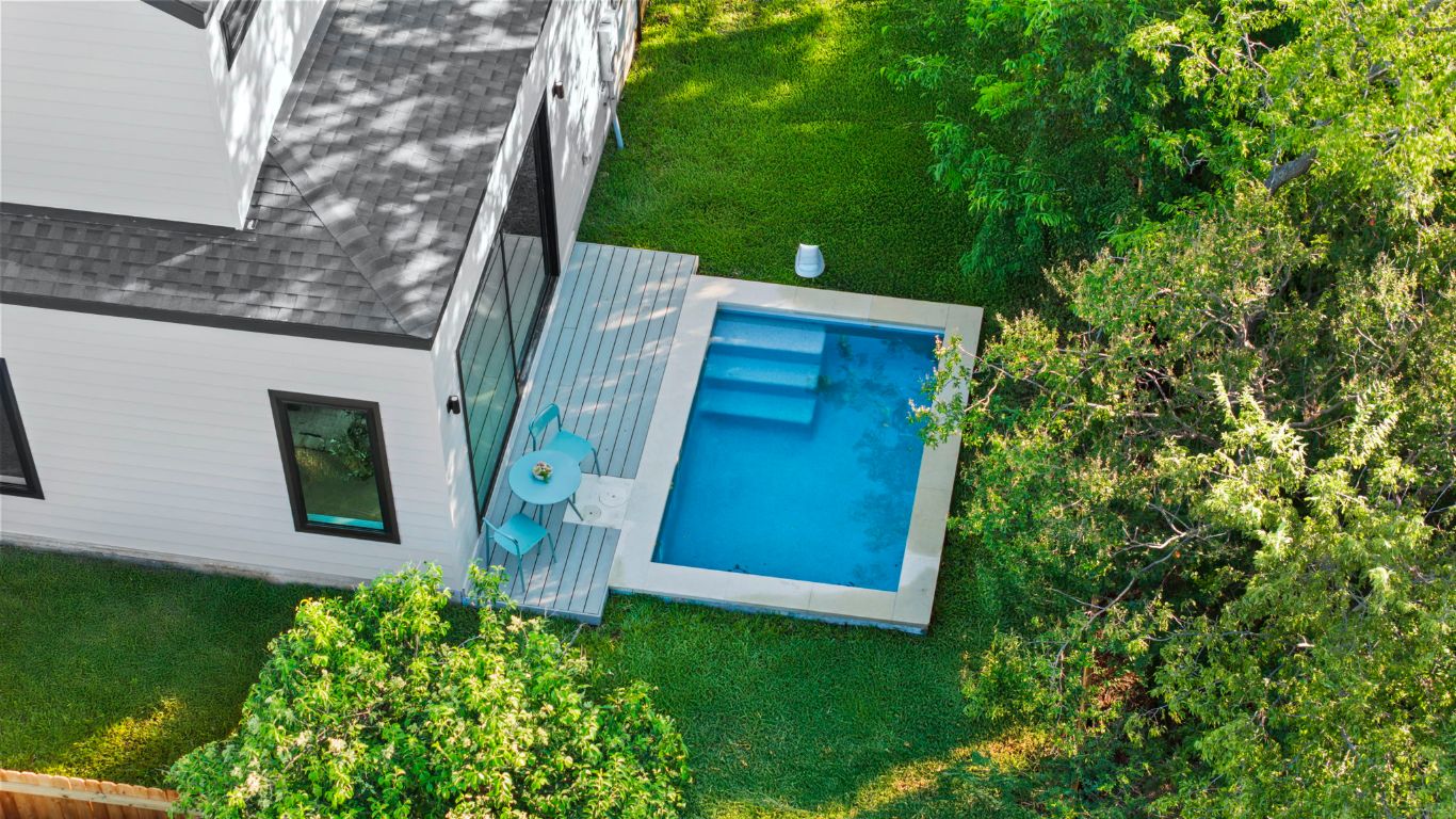 1216 Arcadia Avenue, Unit 2 Austin, TX 78757 - Photo 1 of 14 a view of a house with a backyard