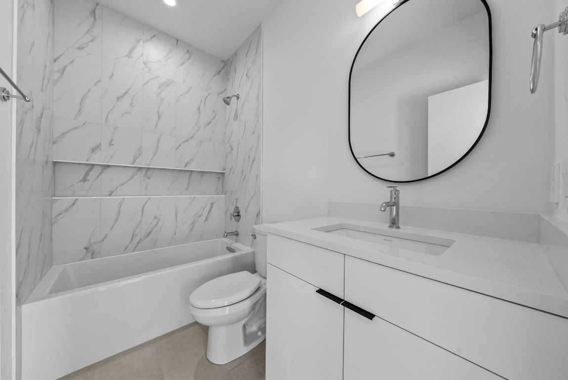 1216 Arcadia Avenue, Unit 2 Austin, TX 78757 - Photo 11 of 14 a bathroom with a sink toilet and shower