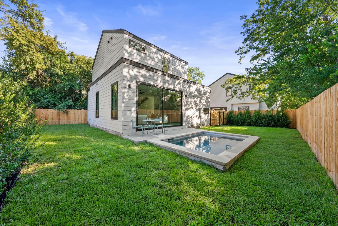 1216 Arcadia Avenue, Unit 2 Austin, TX 78757 - Photo 13 of 14 a view of a house with backyard and garden
