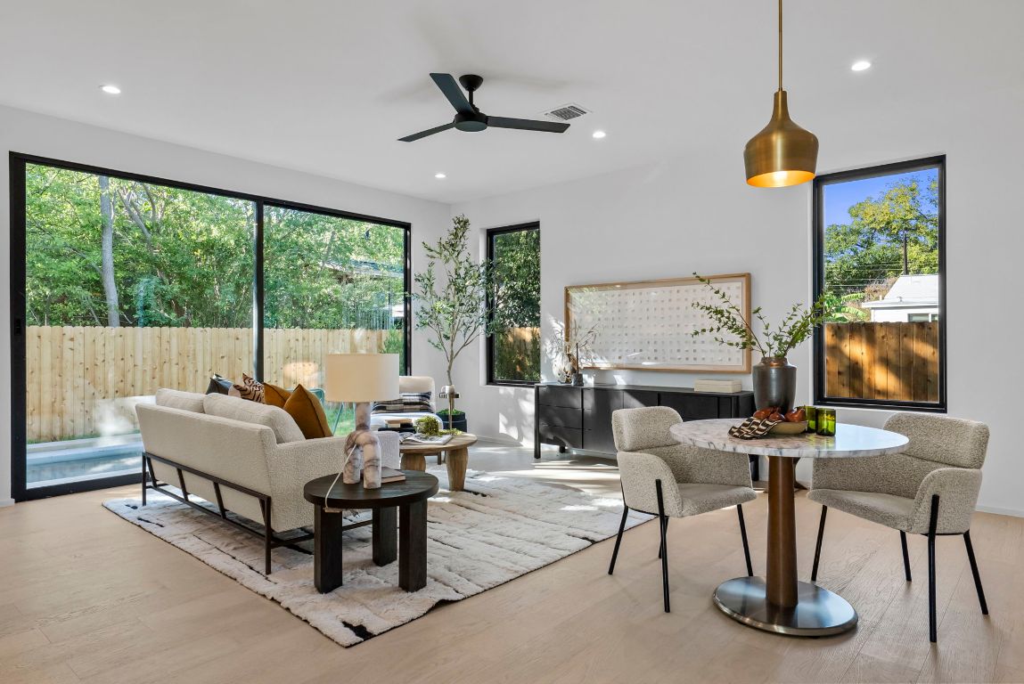 1216 Arcadia Avenue, Unit 2 Austin, TX 78757 - Photo 3 of 14 a living room with furniture and a floor to ceiling window