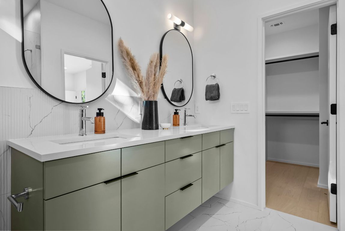 1216 Arcadia Avenue, Unit 2 Austin, TX 78757 - Photo 9 of 14 a bathroom with a sink and a mirror
