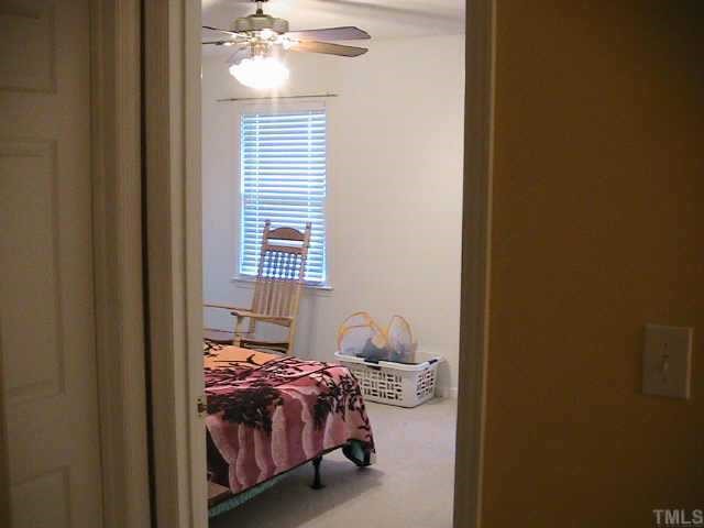 652 Old Stage Road North Coats, NC 27521 - Photo 8 of 10 a bedroom with a bed and a window