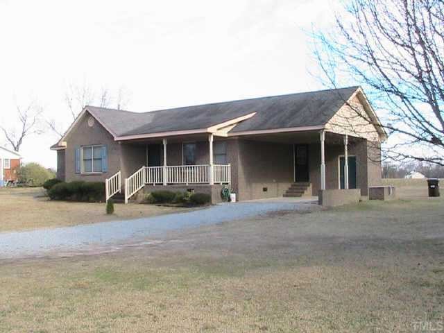 652 Old Stage Road North Coats, NC 27521 - Photo 10 of 10 a front view of a house with yard and parking