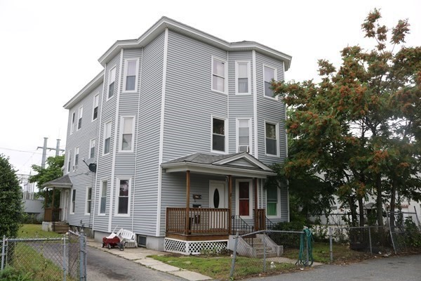 8 Knowlton Avenue Worcester, MA 01603 - Photo 1 of 35 a view of a white house with large windows and a small yard