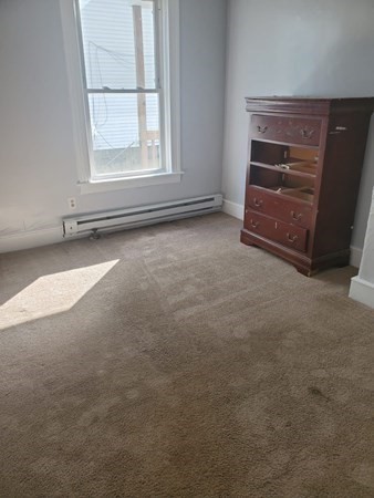 8 Knowlton Avenue Worcester, MA 01603 - Photo 16 of 35 an empty room with a fireplace