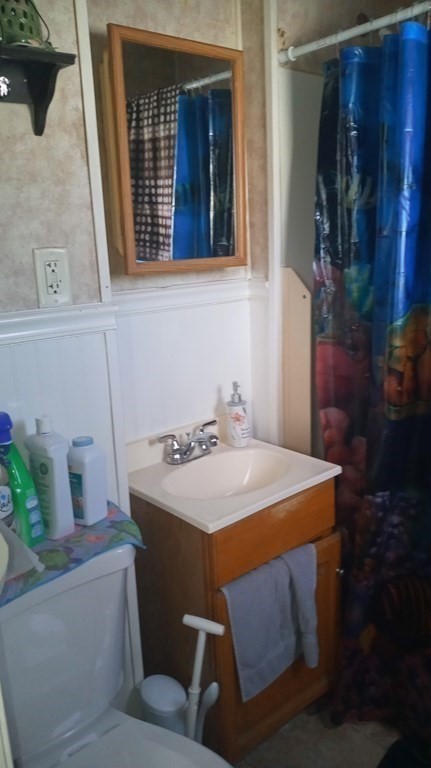 8 Knowlton Avenue Worcester, MA 01603 - Photo 27 of 35 a bathroom with a sink toilet and mirror