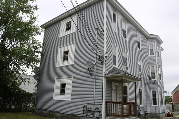 8 Knowlton Avenue Worcester, MA 01603 - Photo 32 of 35 a front view of a house with a yard