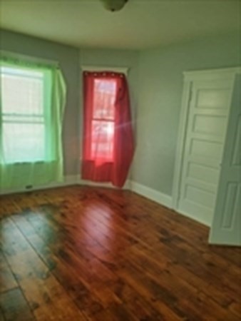 8 Knowlton Avenue Worcester, MA 01603 - Photo 6 of 35 an empty room with wooden floor and windows