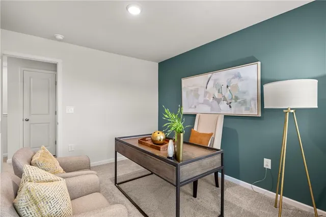 a living room with furniture and a lamp