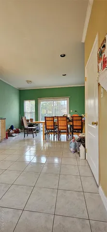 a room with furniture and a large window