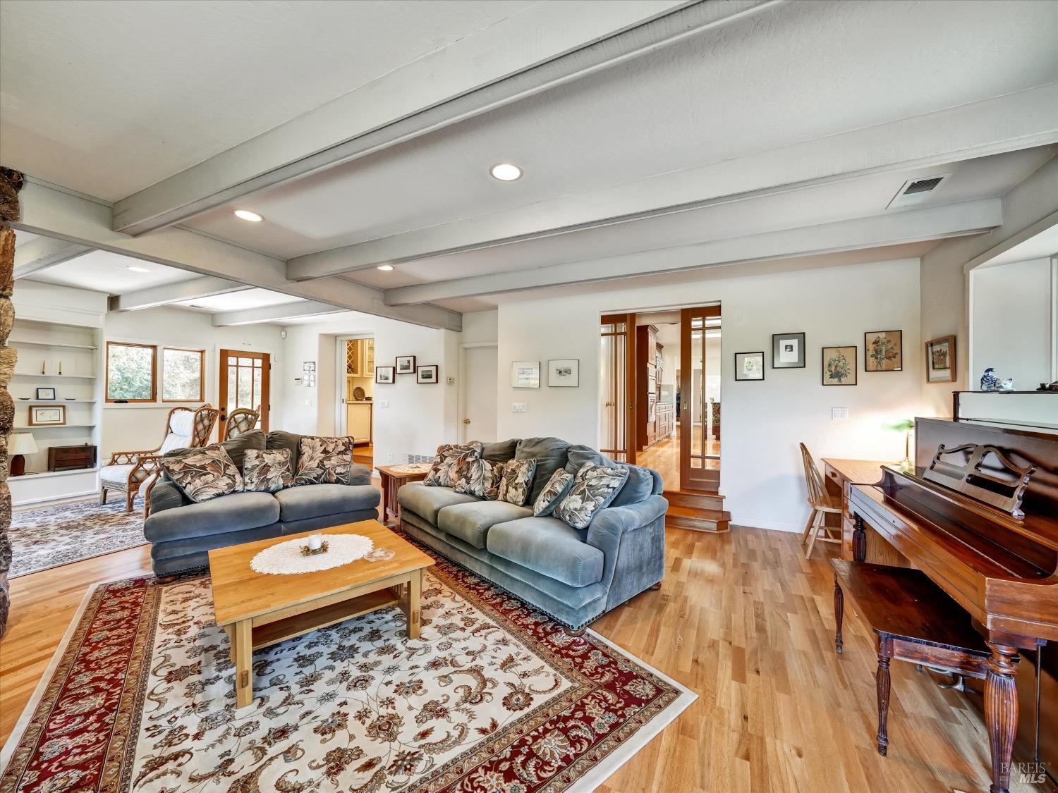 6410 Bennett Valley Road Santa Rosa, CA 95404 - Photo 16 of 34 Family room with fireplace and half bath.
