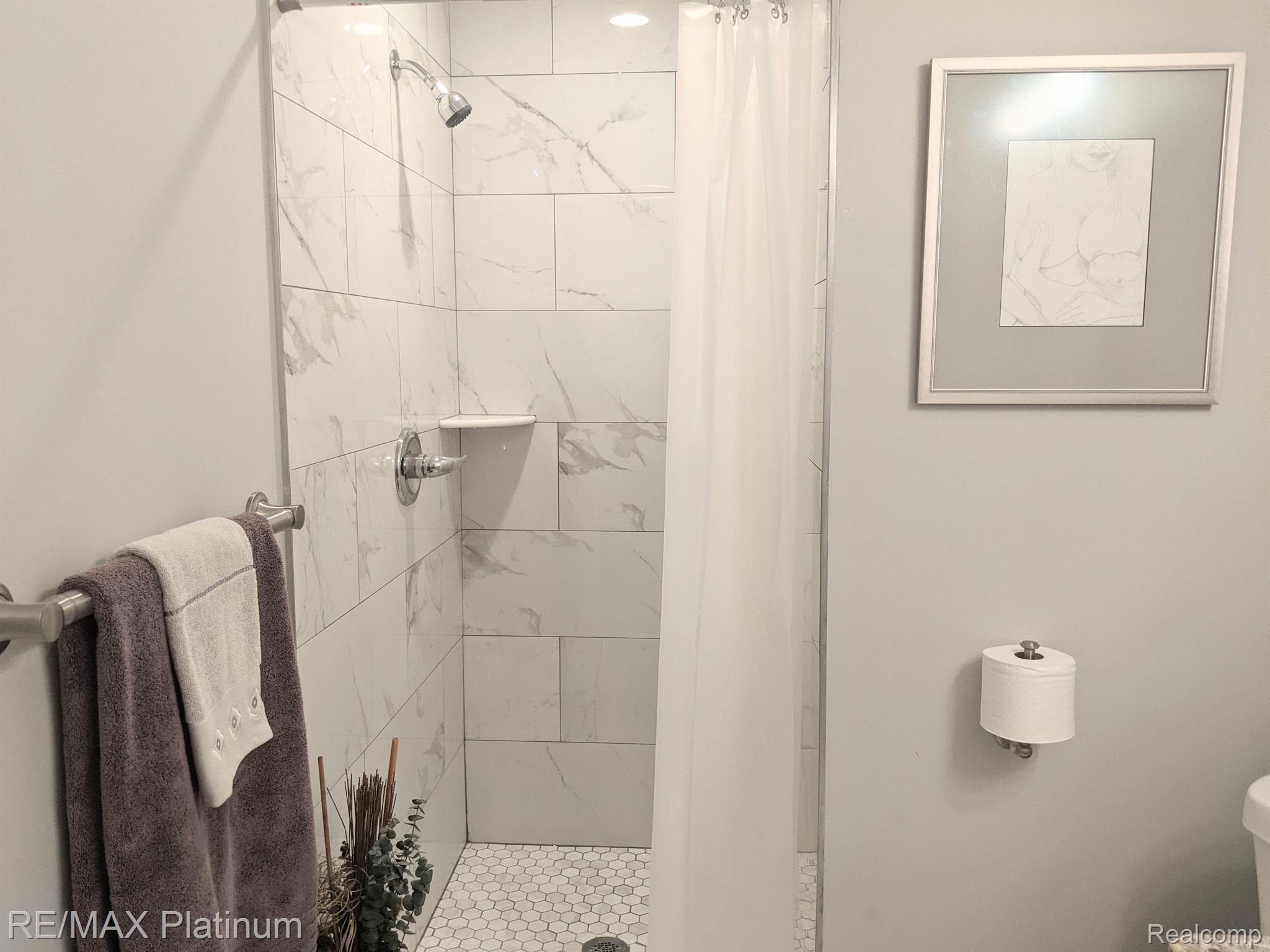 810 Chelsea Ridge Court, Unit 21 Howell, MI 48843 - Photo 35 of 43 Main bath tiled shower