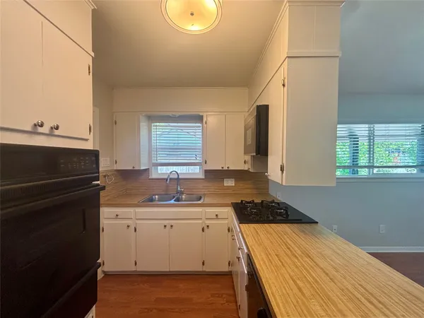 a kitchen with a sink and cabinets