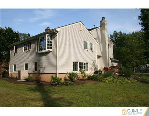 1 Chandler Road Edison, NJ 08820 - Photo 2 of 24 a view of front of house with a yard