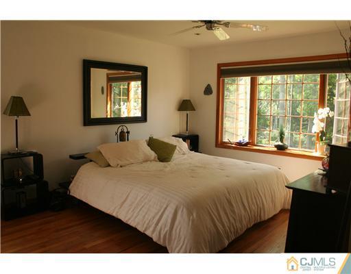 1 Chandler Road Edison, NJ 08820 - Photo 12 of 24 a bedroom with a bed and a large window