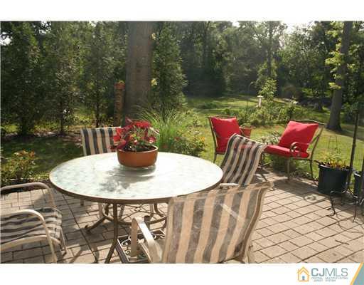1 Chandler Road Edison, NJ 08820 - Photo 13 of 24 a view of a dining table and chairs in the patio