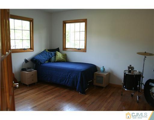 1 Chandler Road Edison, NJ 08820 - Photo 14 of 24 a living room with furniture and a window