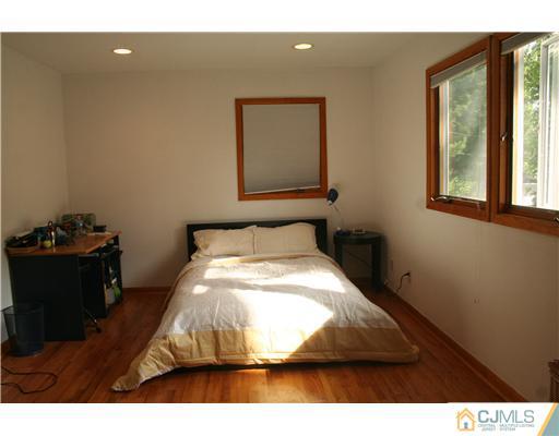 1 Chandler Road Edison, NJ 08820 - Photo 15 of 24 a room with a bed and a window