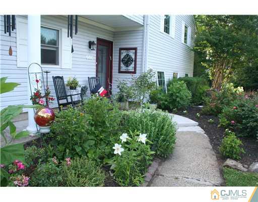 1 Chandler Road Edison, NJ 08820 - Photo 3 of 24 a view of a backyard with plants and chairs