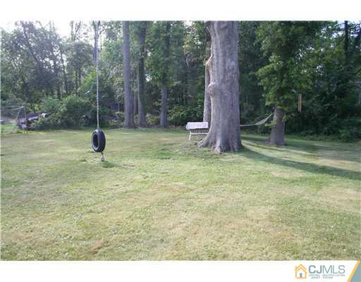 1 Chandler Road Edison, NJ 08820 - Photo 22 of 24 a backyard of a house with lots of green space