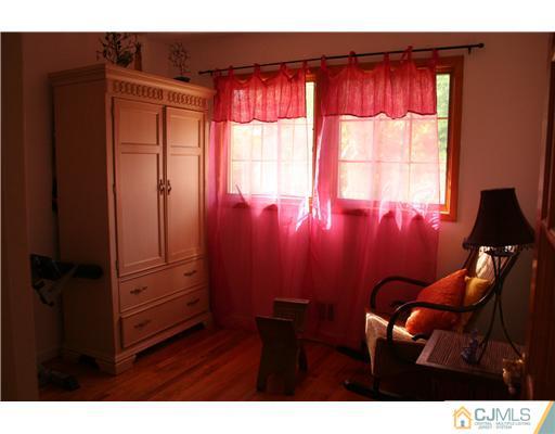 1 Chandler Road Edison, NJ 08820 - Photo 24 of 24 a view of a room with furniture and a window