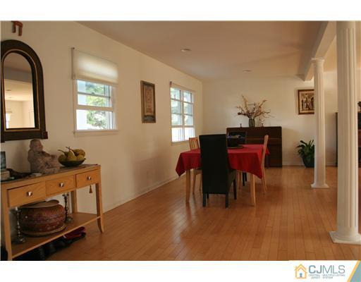 1 Chandler Road Edison, NJ 08820 - Photo 5 of 24 a living room with furniture and a dining table