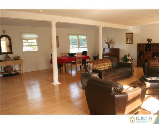 1 Chandler Road Edison, NJ 08820 - Photo 7 of 24 a living room with furniture and wooden floor