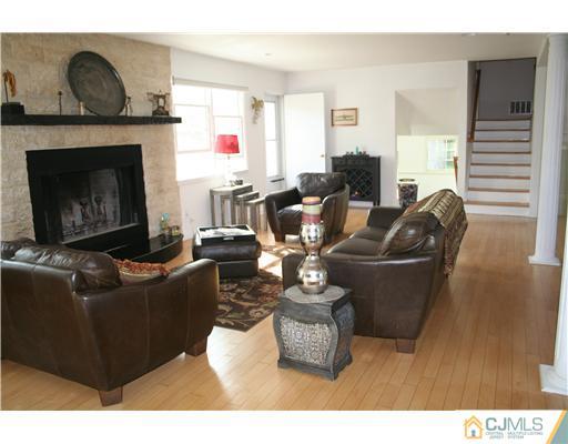1 Chandler Road Edison, NJ 08820 - Photo 10 of 24 a living room with furniture and a fireplace