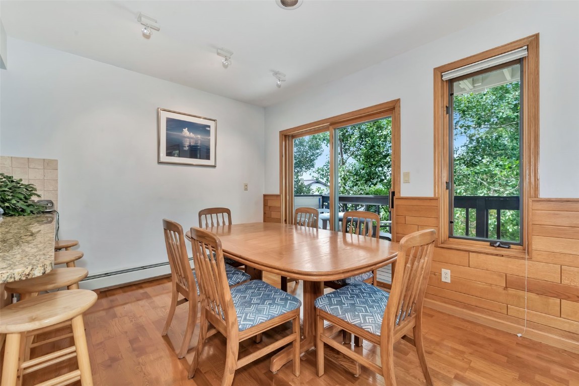 2116 Aster Place Steamboat Springs, CO 80487 - Photo 15 of 42 a dining room with furniture and wooden floor