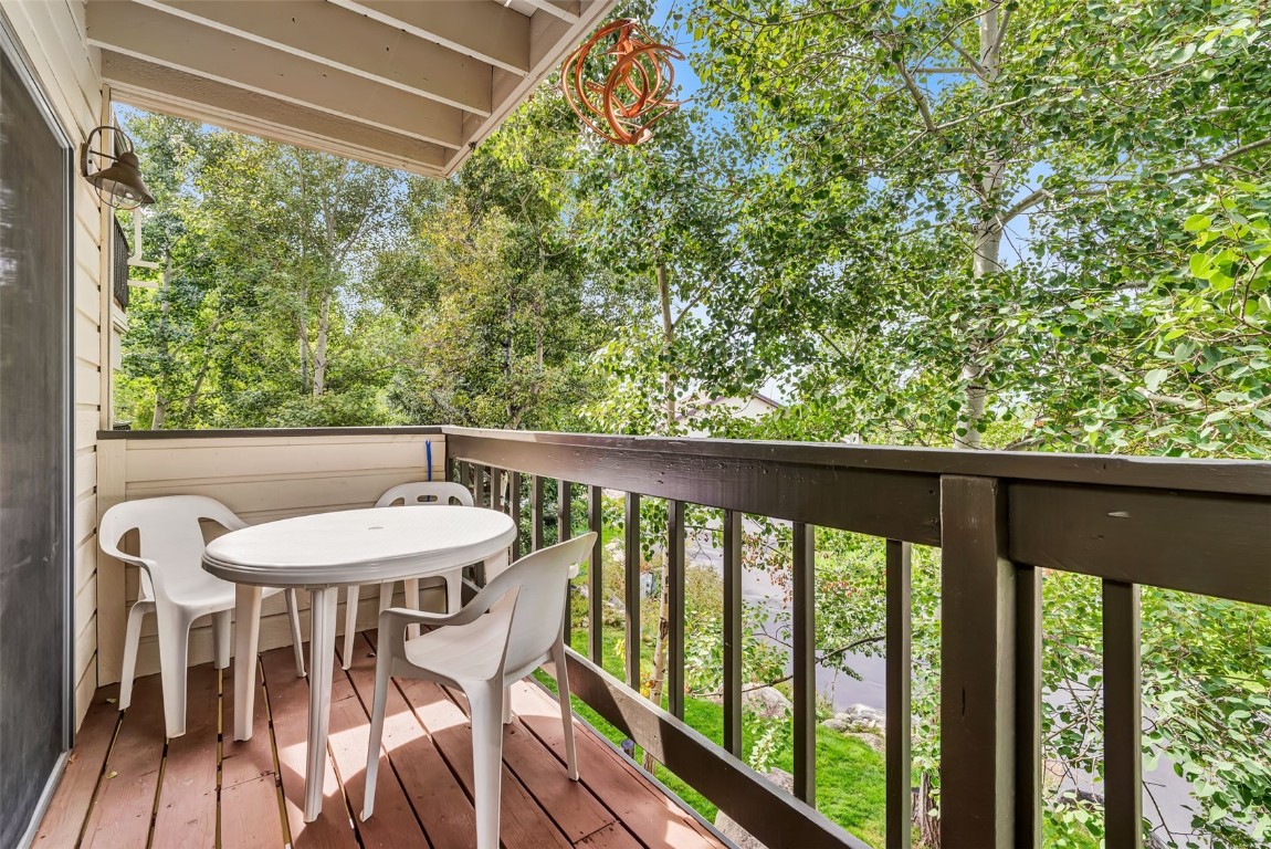 2116 Aster Place Steamboat Springs, CO 80487 - Photo 16 of 42 a balcony with table and chairs