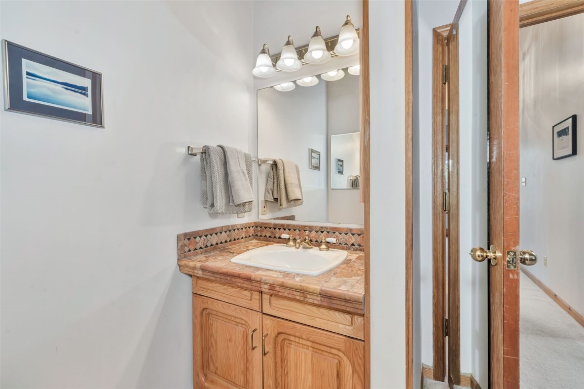 2116 Aster Place Steamboat Springs, CO 80487 - Photo 20 of 42 a bathroom with a sink and a mirror
