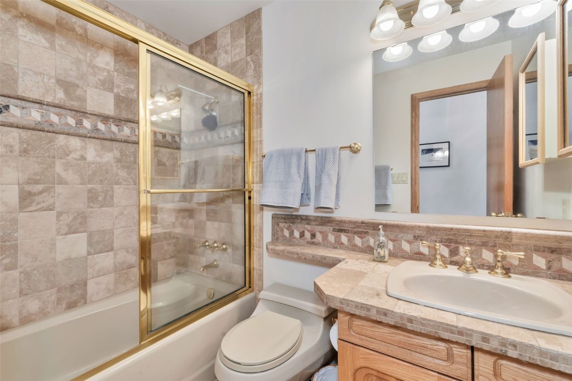 2116 Aster Place Steamboat Springs, CO 80487 - Photo 24 of 42 a bathroom with a sink a toilet and shower