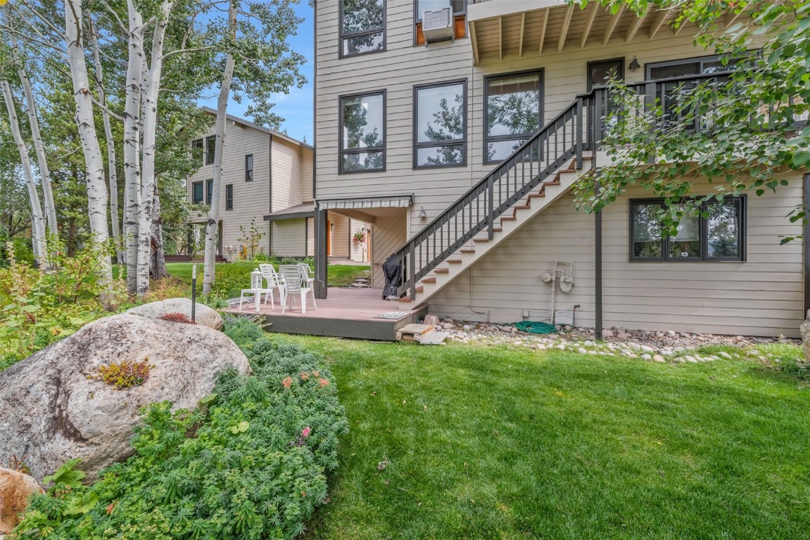 2116 Aster Place Steamboat Springs, CO 80487 - Photo 33 of 42 front view of a house with a yard