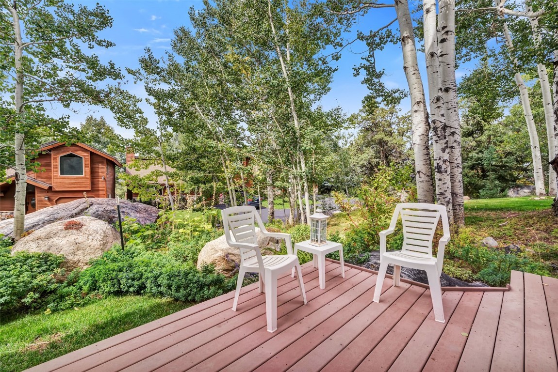 2116 Aster Place Steamboat Springs, CO 80487 - Photo 36 of 42 a view of a chairs and table on the wooden floor