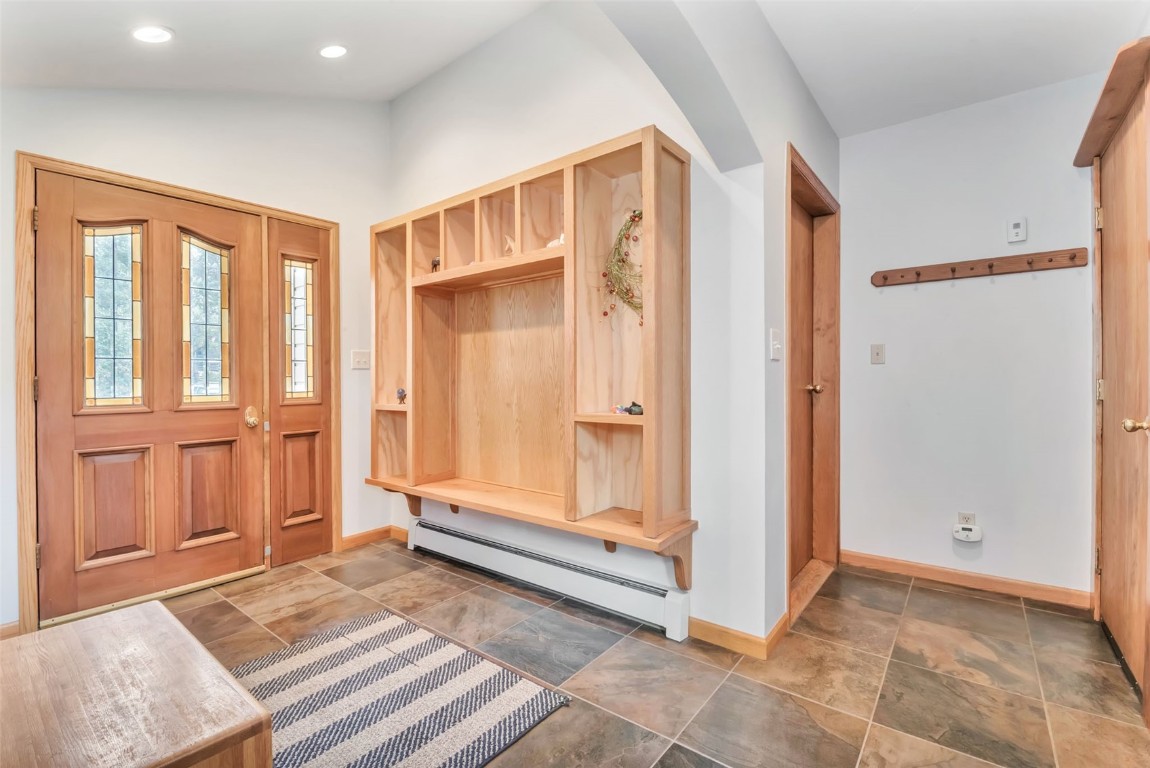 2116 Aster Place Steamboat Springs, CO 80487 - Photo 4 of 42 a view of entryway with an empty room and wooden floor
