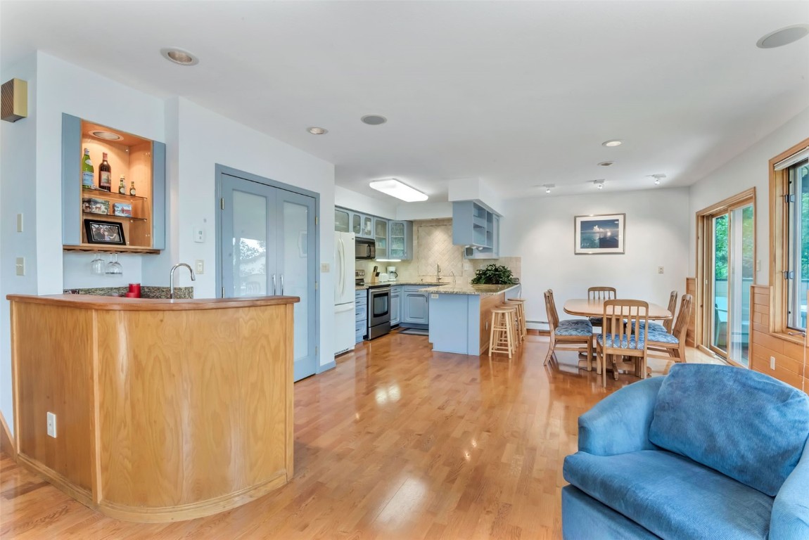 2116 Aster Place Steamboat Springs, CO 80487 - Photo 10 of 42 a living room with furniture a dining table and kitchen view