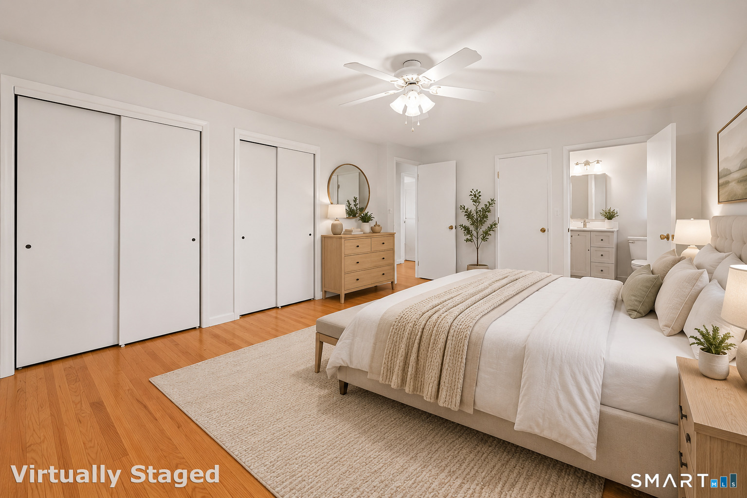 142 Wolcott Hill Road Wethersfield, CT 06109 - Photo 12 of 29 a bedroom with a bed and a chandelier