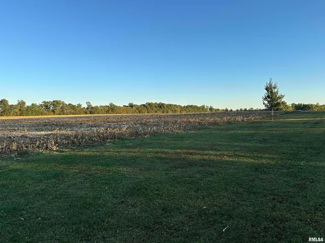a view of lake with green space