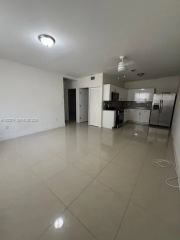 a view of a kitchen with a sink