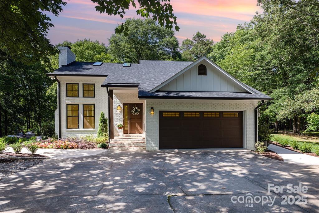 6639 Camp Creek Road Lancaster, SC 29720 - Photo 1 of 42 a front view of a house with a yard and garage