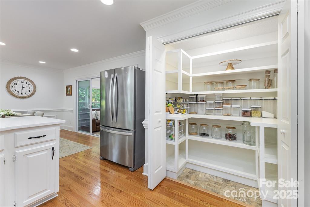 6639 Camp Creek Road Lancaster, SC 29720 - Photo 13 of 42 a kitchen with white cabinets and wooden floor