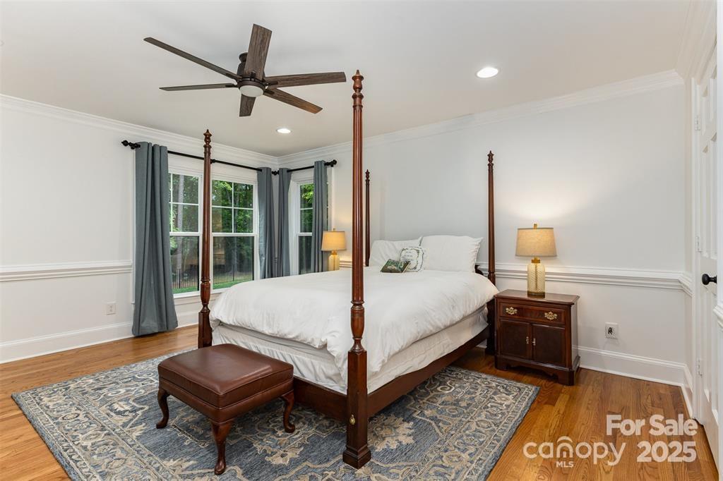 6639 Camp Creek Road Lancaster, SC 29720 - Photo 17 of 42 a bedroom with a bed and wooden floor