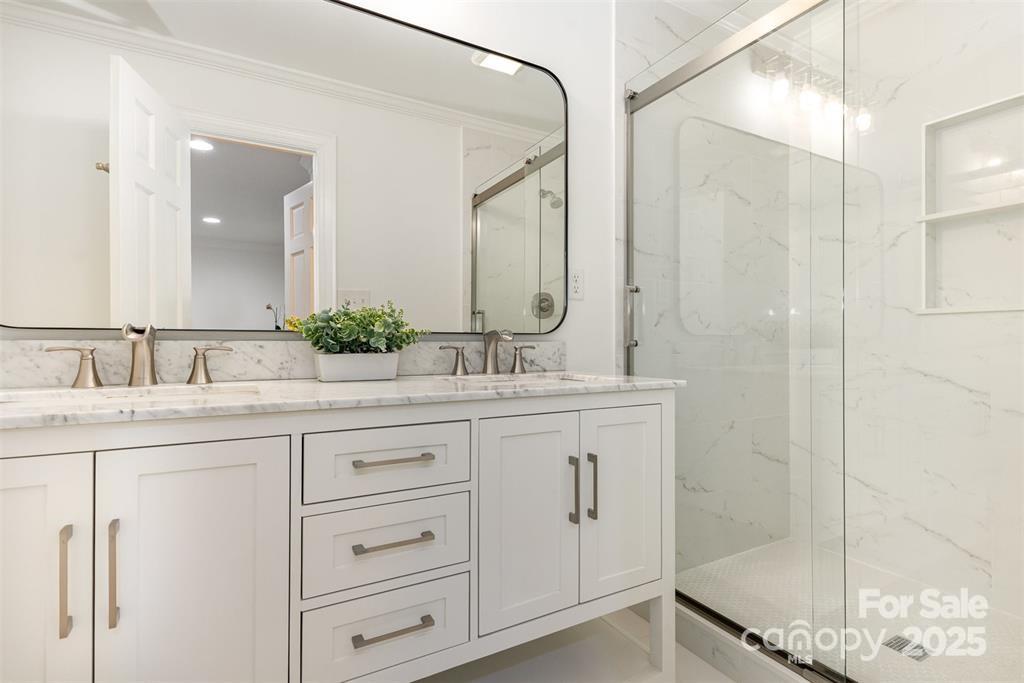 6639 Camp Creek Road Lancaster, SC 29720 - Photo 19 of 42 a bathroom with a granite countertop sink mirror and double
